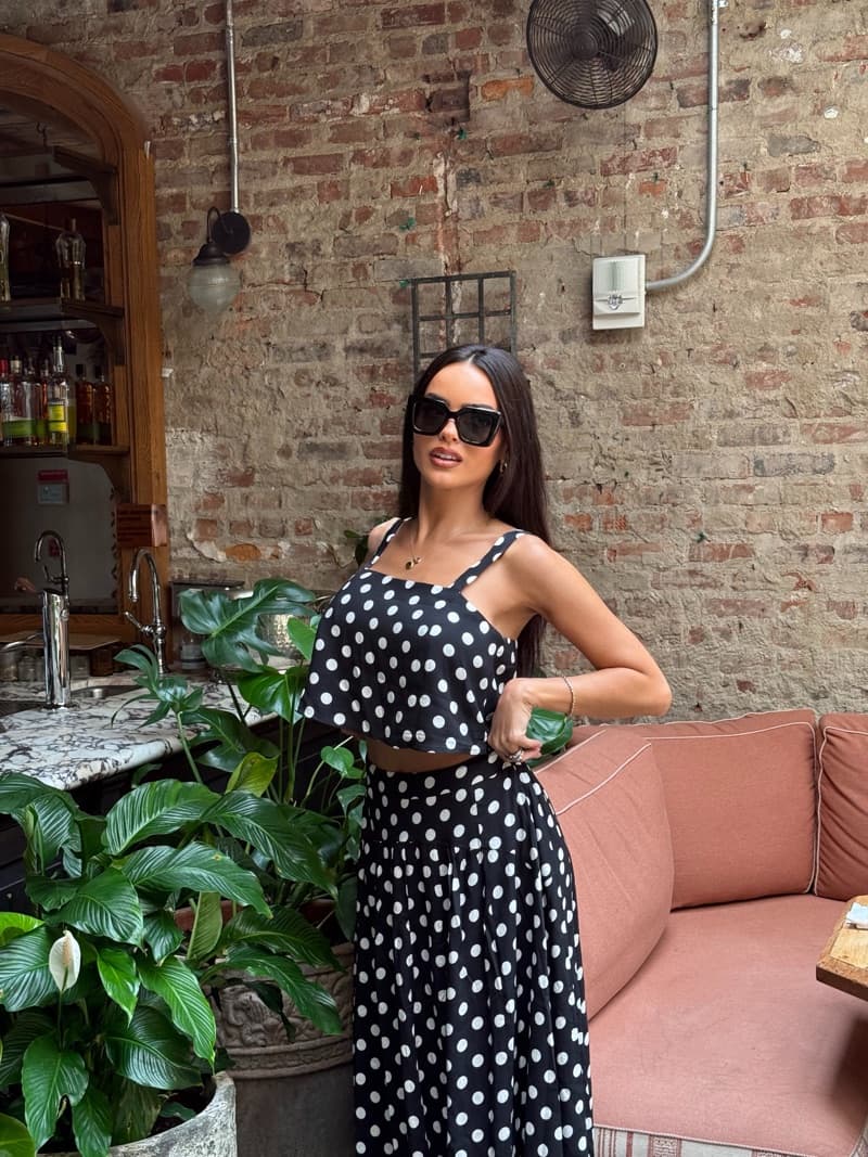Lisa Ramos wearing a black and white polka dot outfit