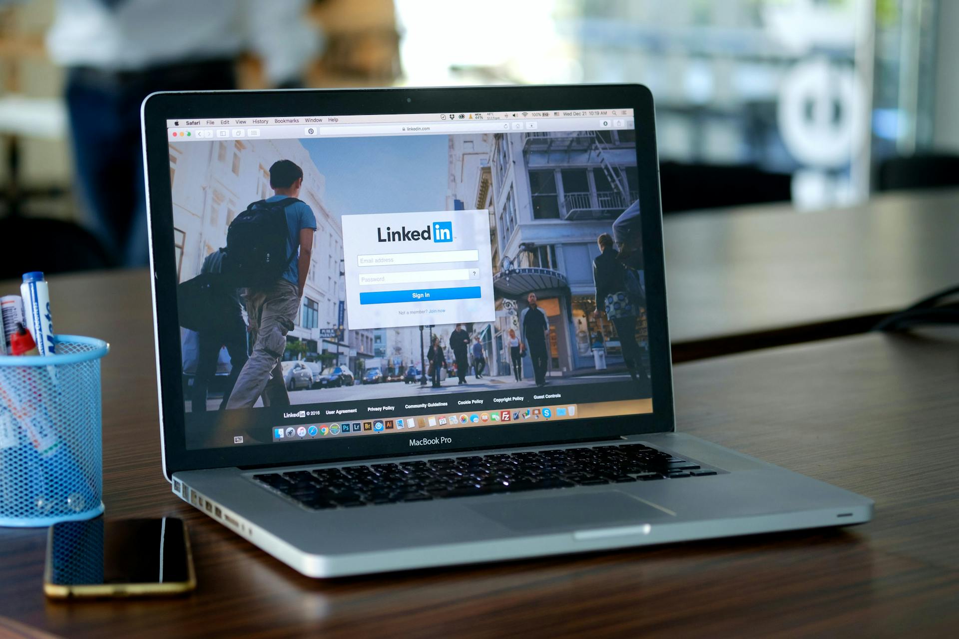 open laptop on a desk with Linkedin login on the screen