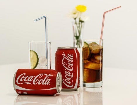 Coca-Cola cans and glasses.