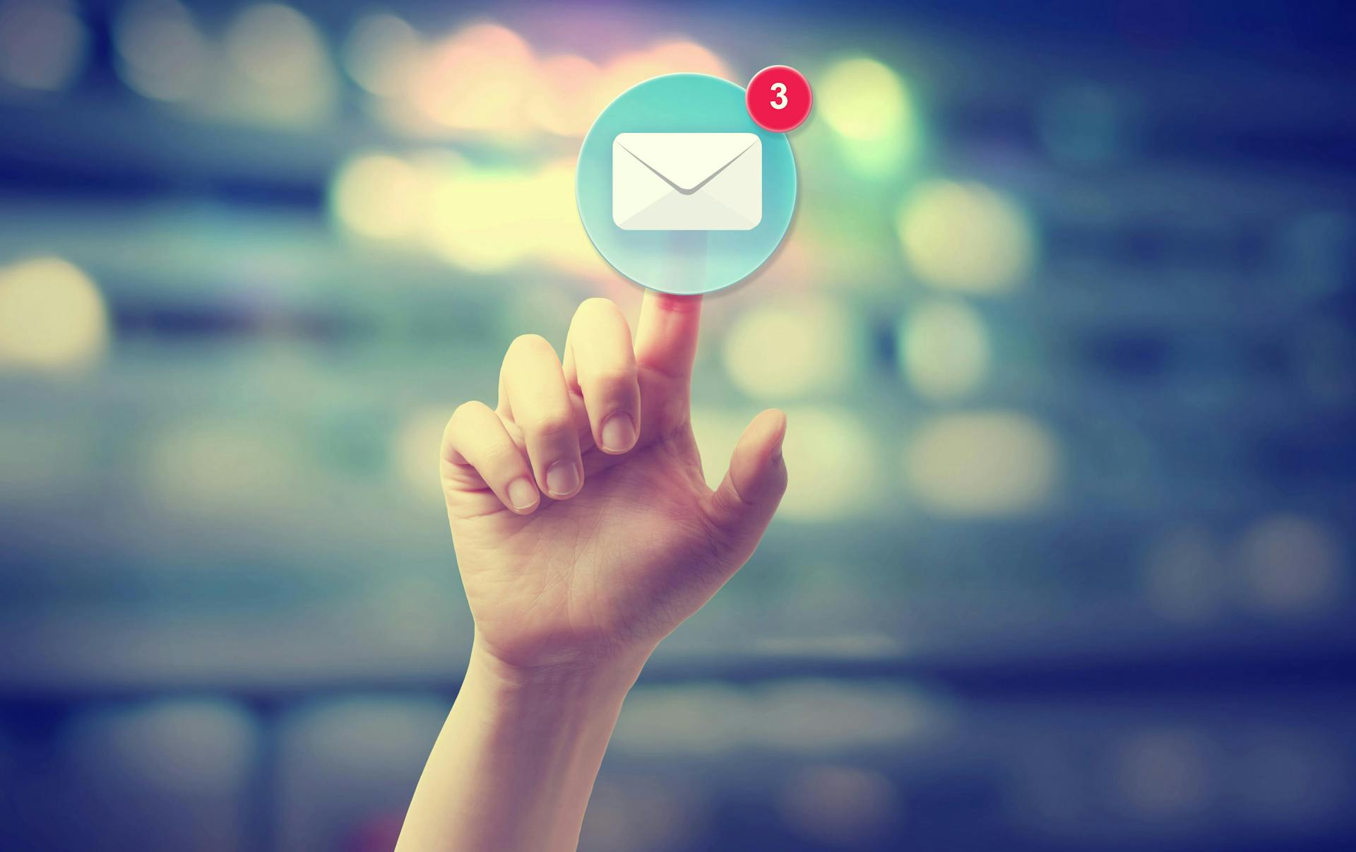 A hand reaching out to an email icon signifying you have mail. 