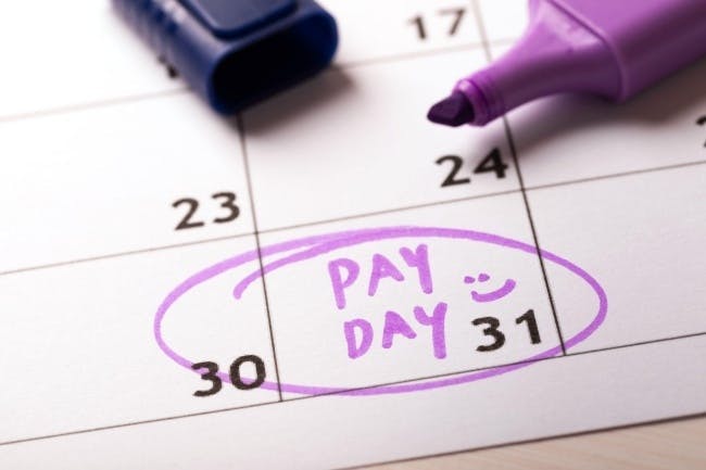 Photo of a marker highlighting pay day