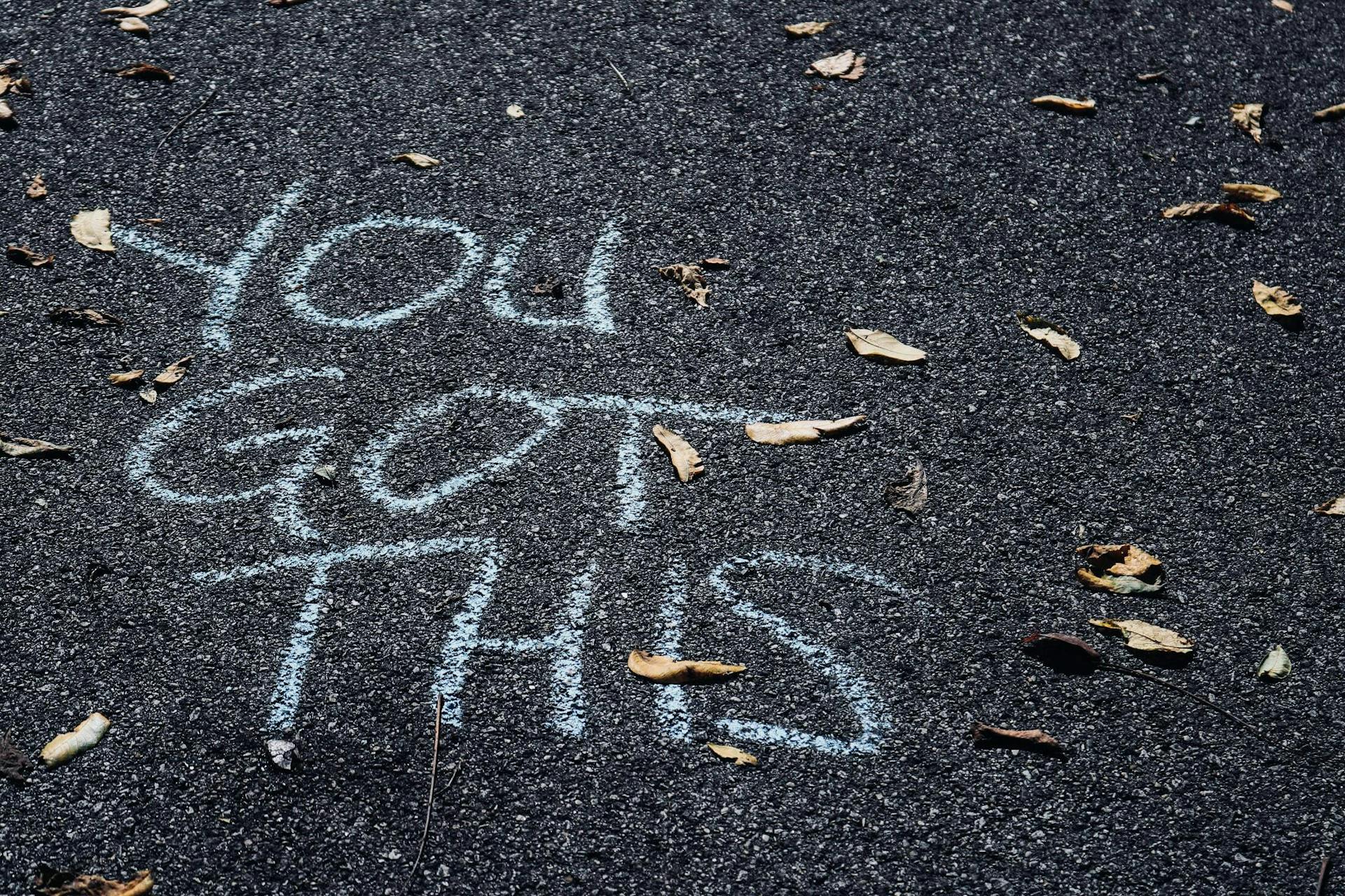 White text in sidewalk chalk saying "You Got This". Understanding what message you want to send is important to your company communication plan. 