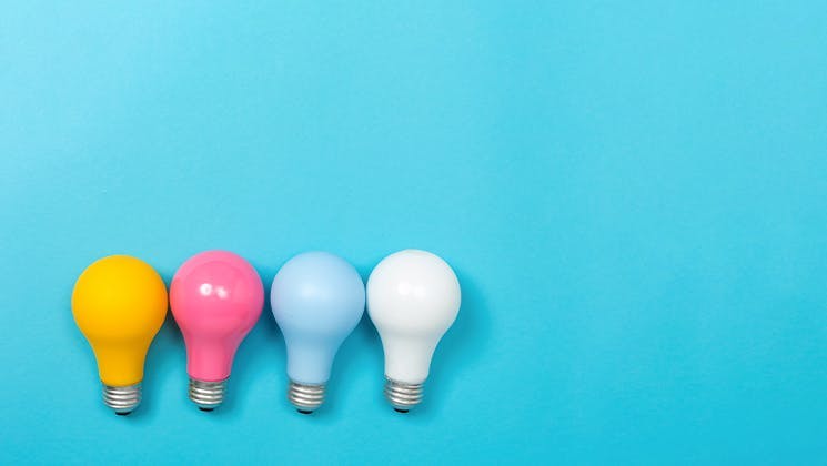 Colourful light bulbs side by side