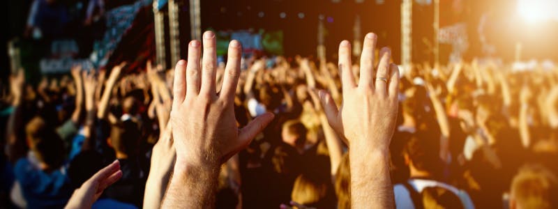 Photo of hands up in a crowd