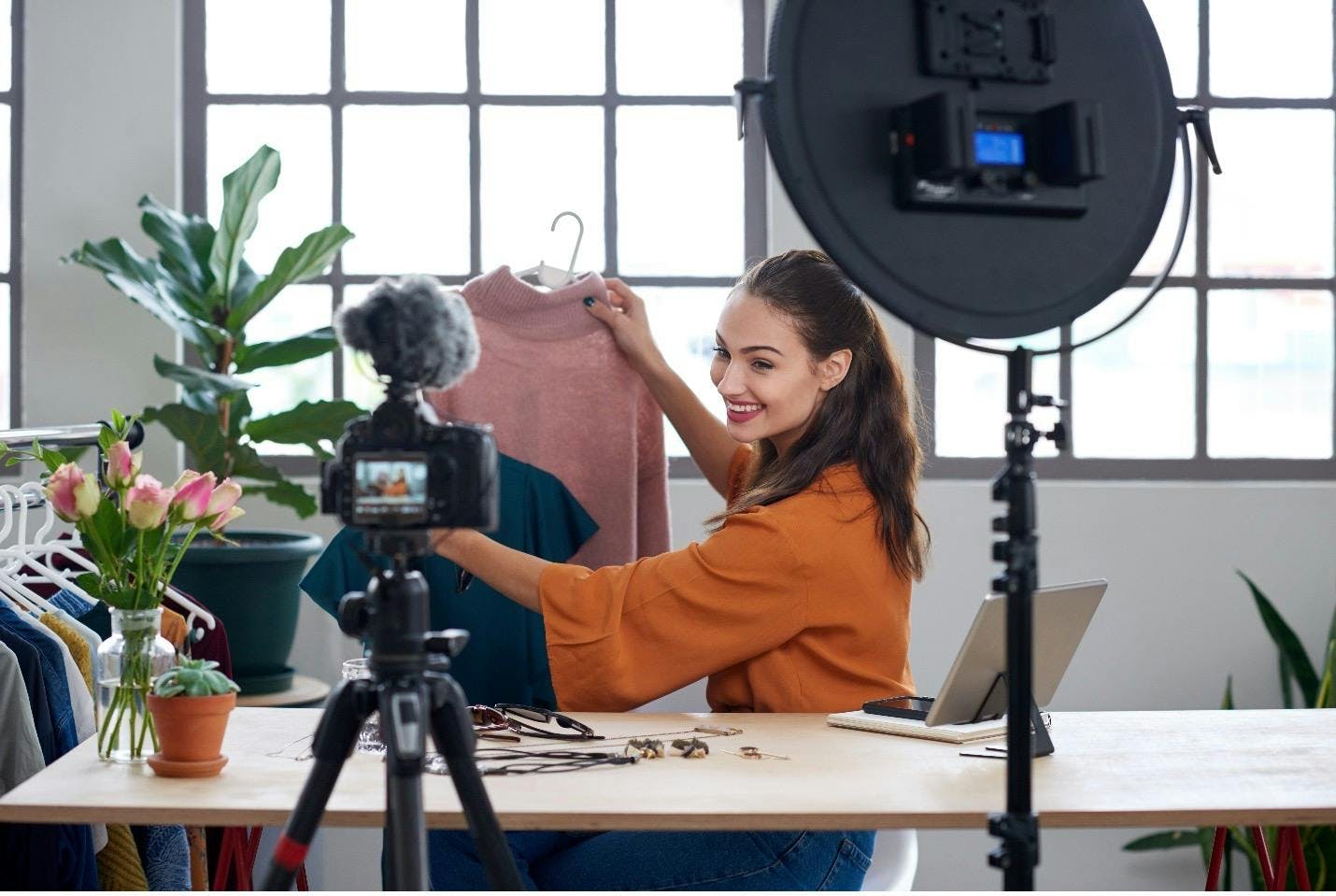 Influencer creating a video podcast to create brand awareness and press for a clothing brand