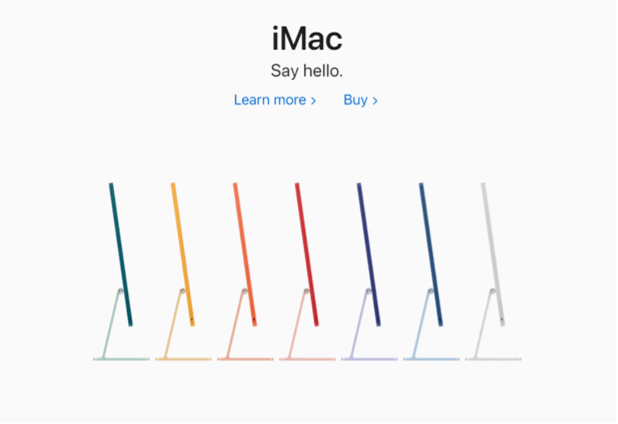 The homepagina van de Apple landing page waarop iMac producten worden verkocht. Het is een strak, simpel ontwerp met een dikgedrukt kopje dat zegt "iMac" in het zwart, zeven iMac computers in de regenboog kleuren, en een witte achtergrond.