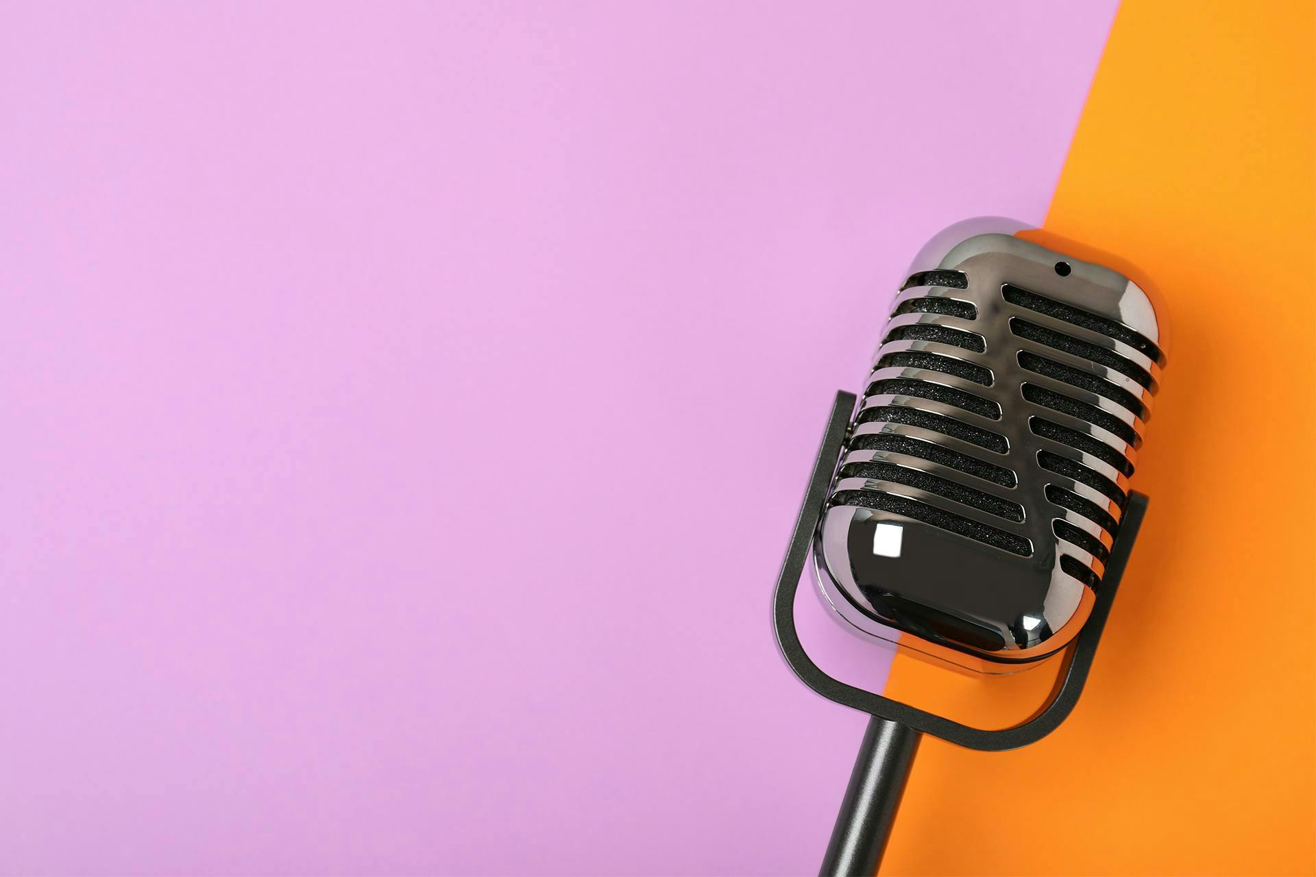 Looking for the latest social media news? This blog has it. This image of a retro-looking microphone against a solid background conveys the message that news is being broadcast