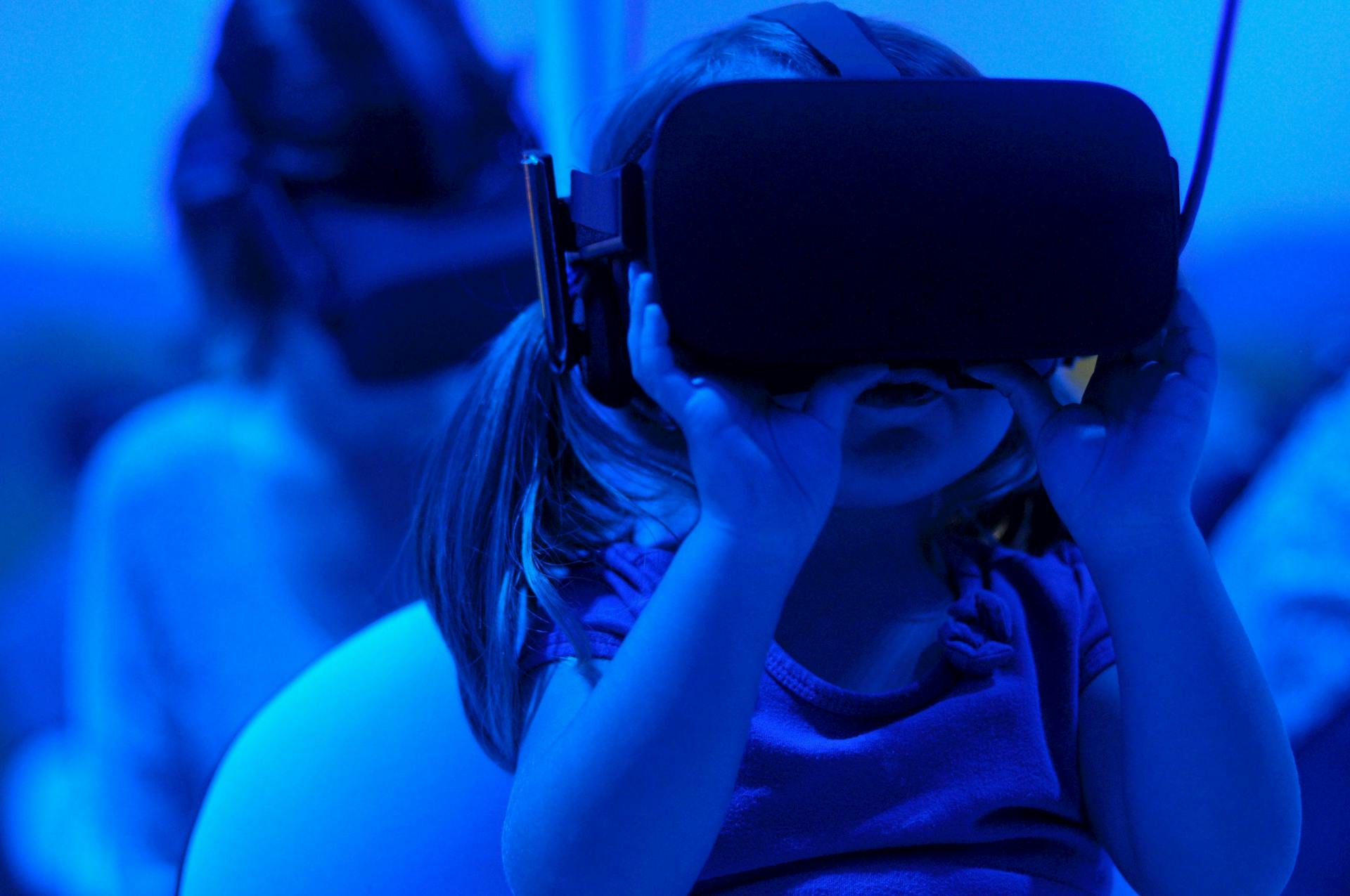 Young girl wearing virtual reality headset. VR and AR are key areas to watch in content marketing.
