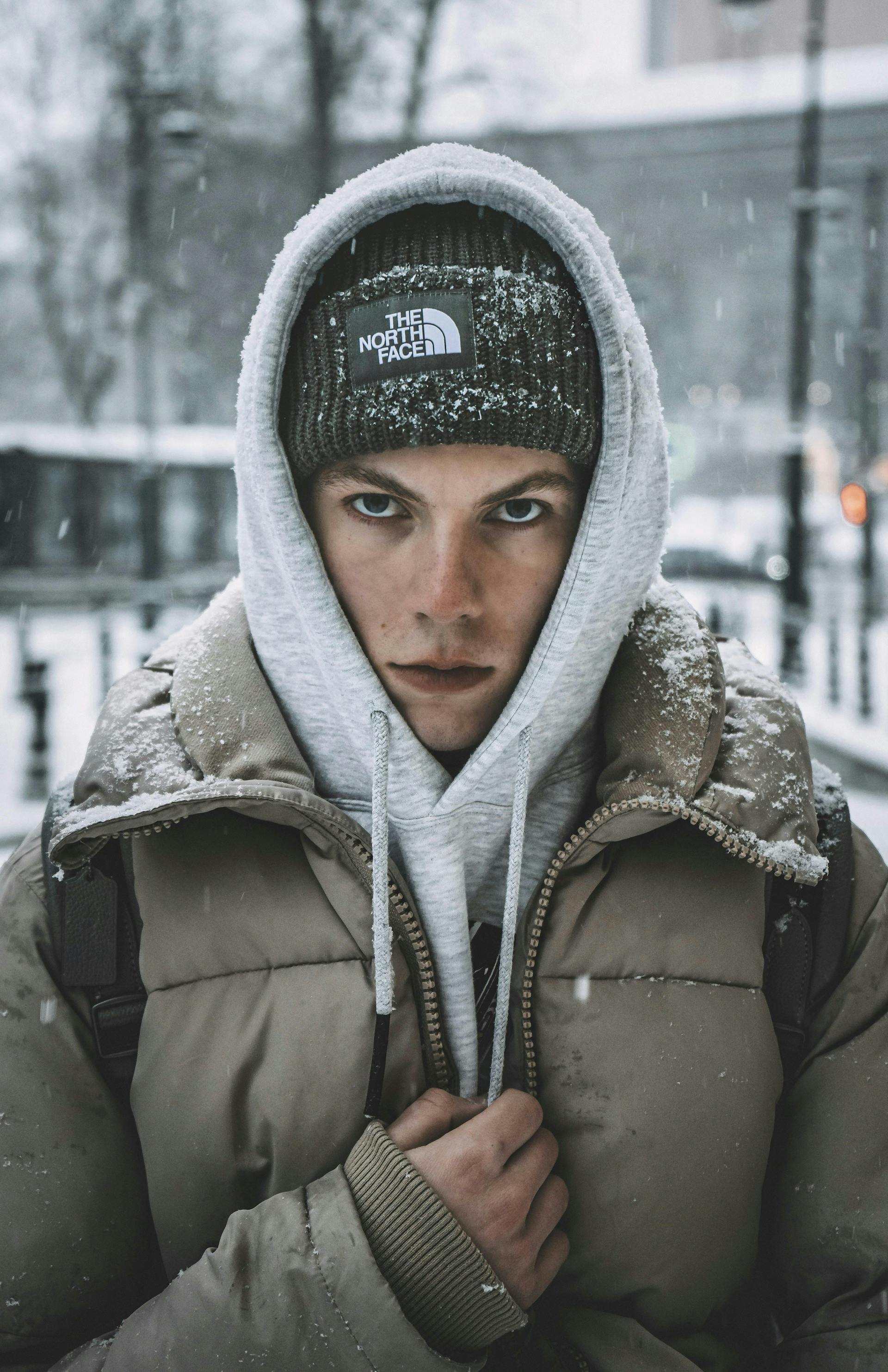 Man wearing North Face branded clothing in the snow