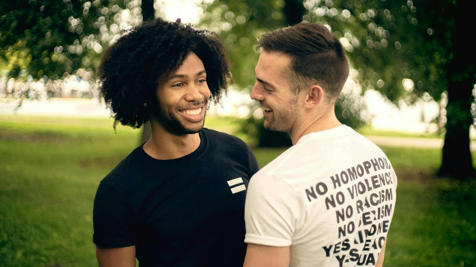 Photo of two guys smiling at each other