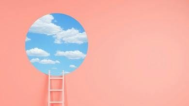 Picture of a ladder reaching the sky in a circle on pink background