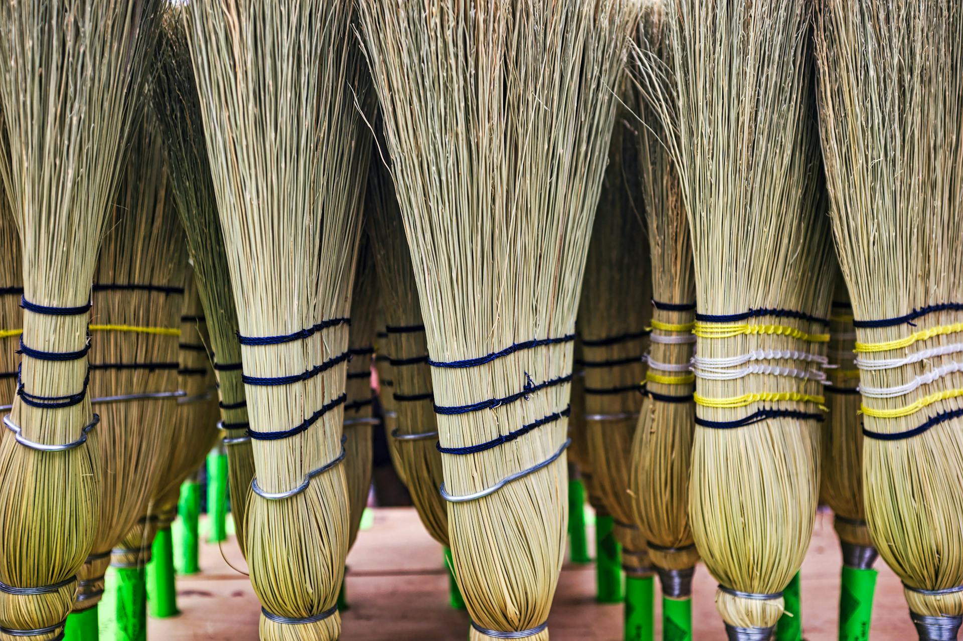 Row of traditional looking brooms