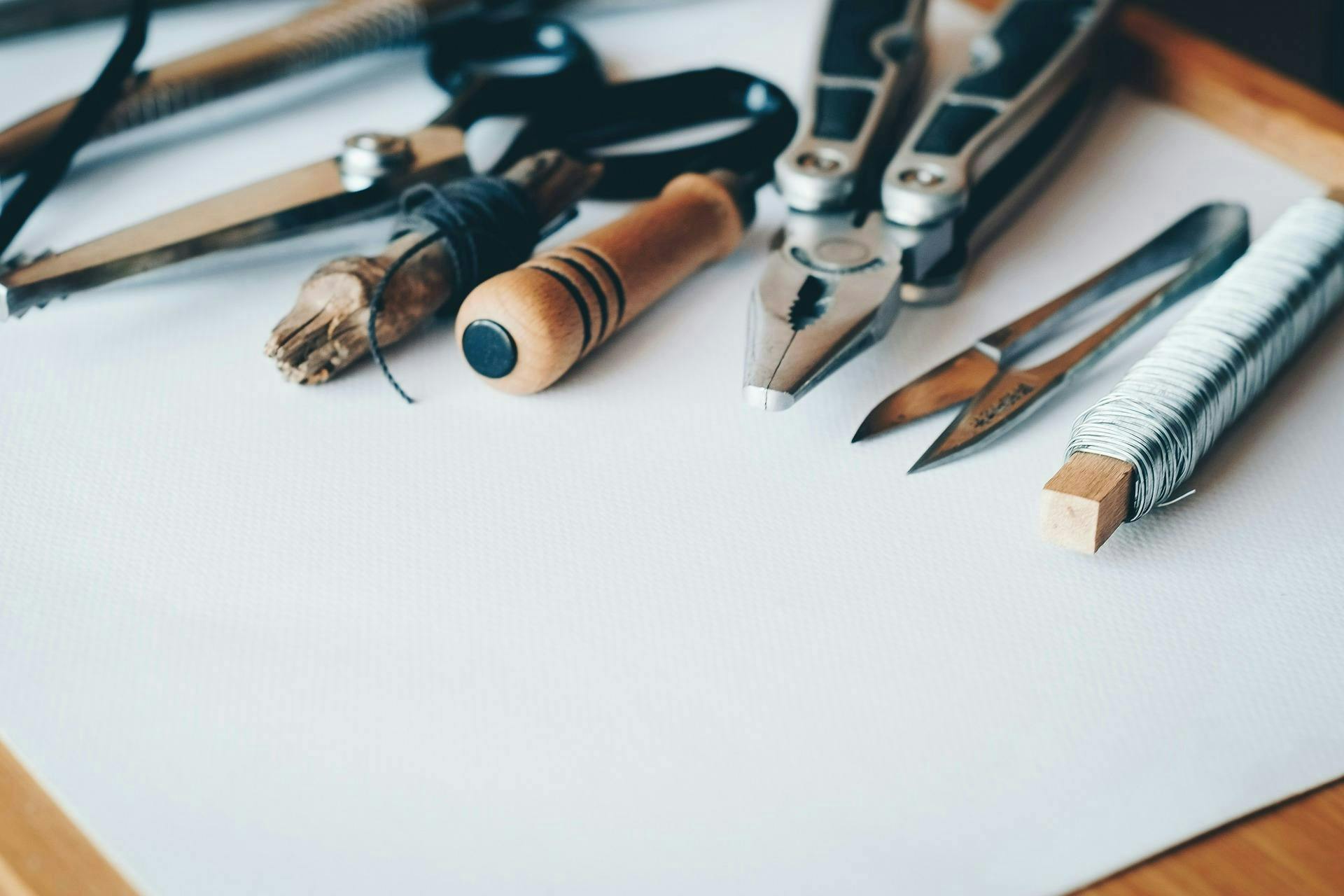 Picture of various tools on a white piece of paper.